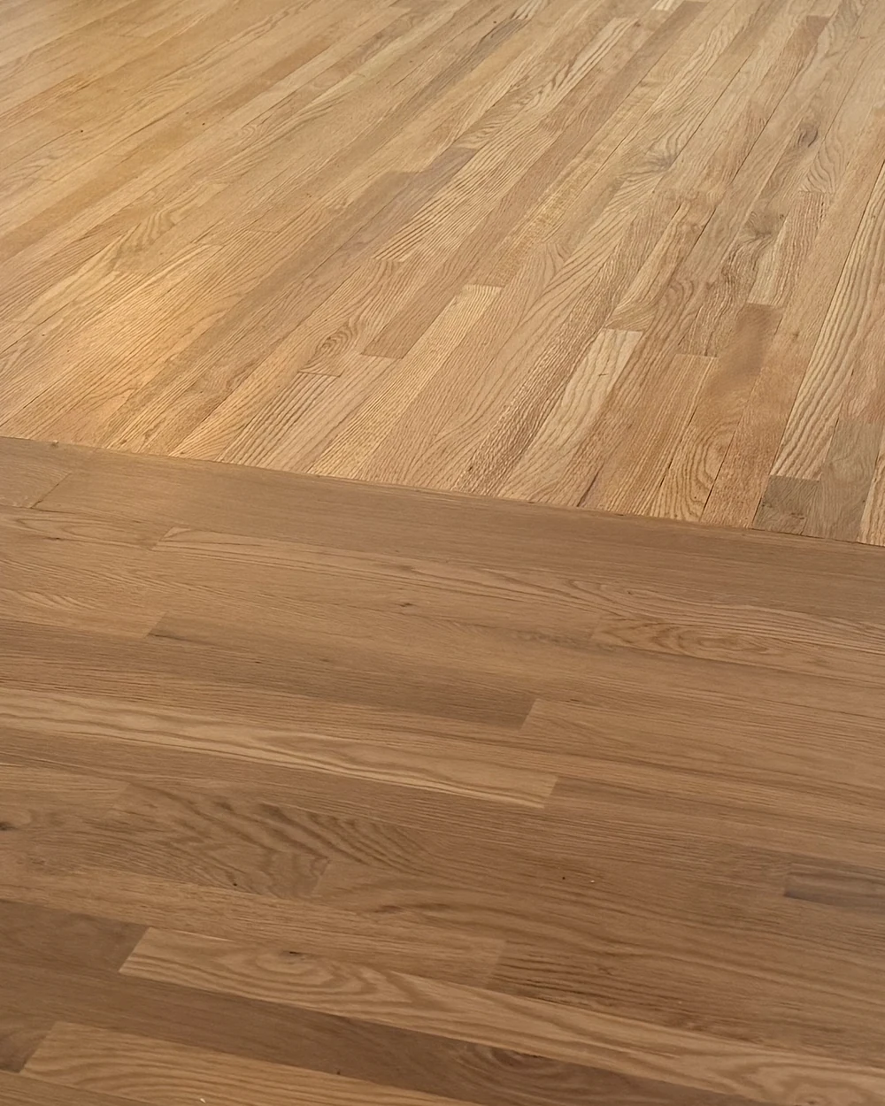 New flooring color-matched into an existing floor at the seam