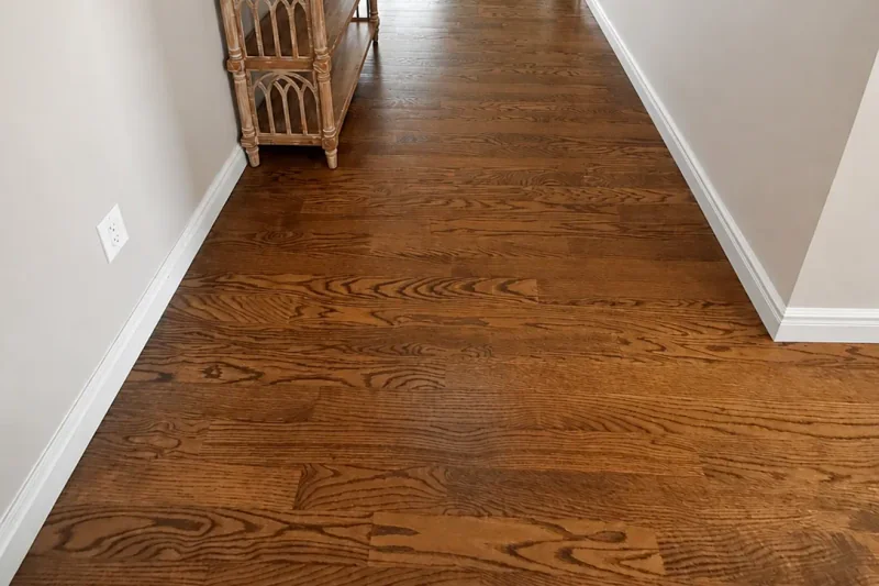 Upstairs hallway with refinished oak flooring leading to a bright sitting room