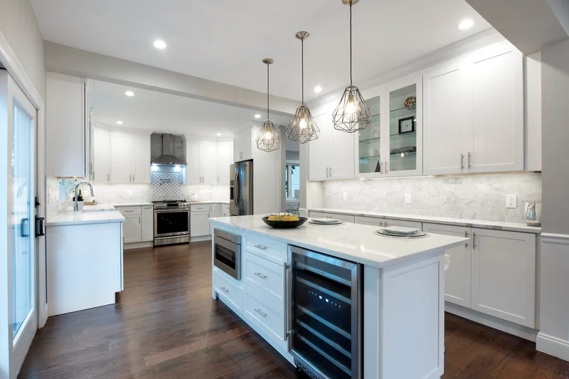 Dark hardwood in an open kitchen with a long island and a glass-front wine cooler