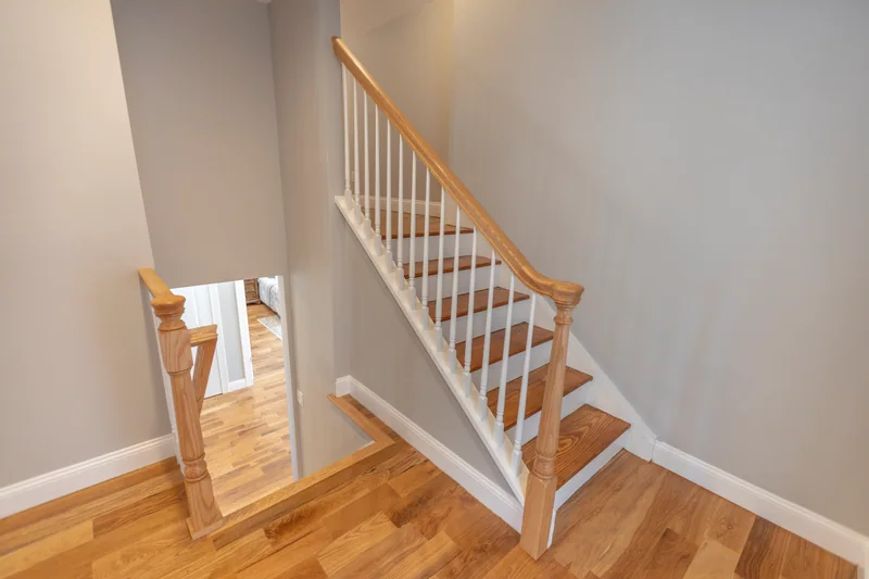 Golden hardwood on a stair and upper landing, seen from above