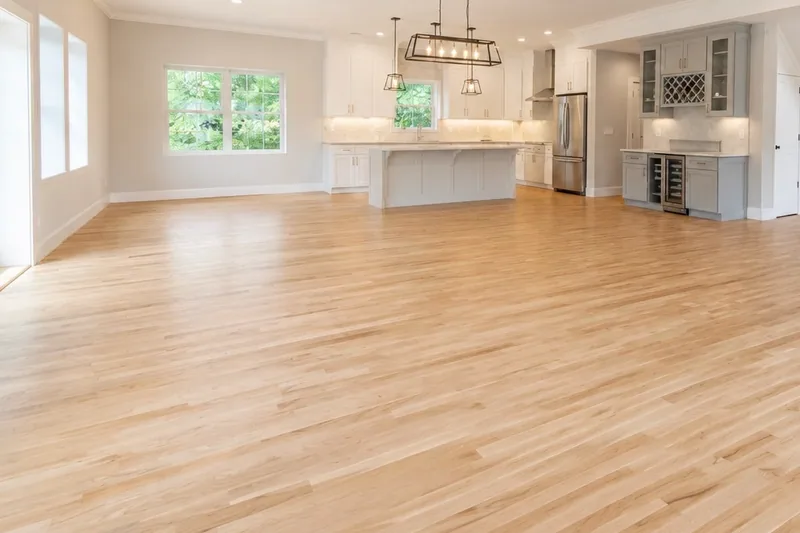 Light natural white oak running through an open, sun-filled main level