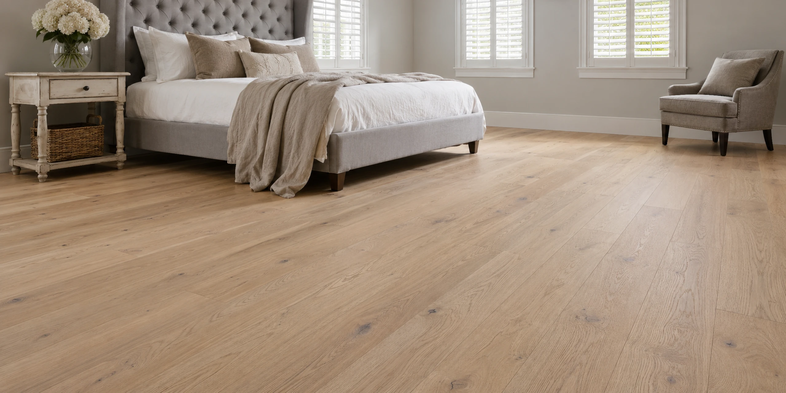Wide-plank white oak flooring in a warm, light-filled bedroom