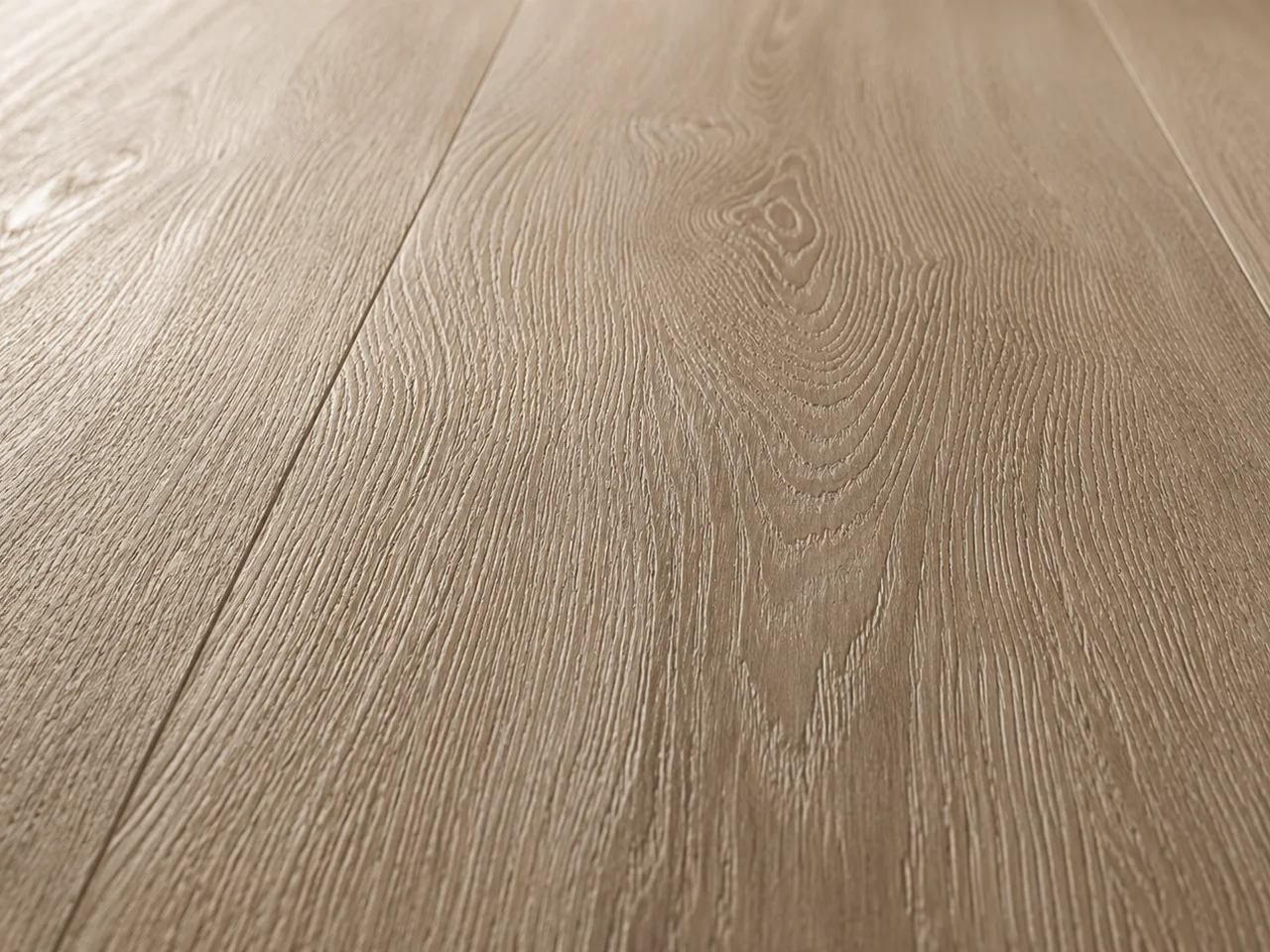 Close-up of embossed-in-register texture aligned to the printed grain on wide greige-oak plank